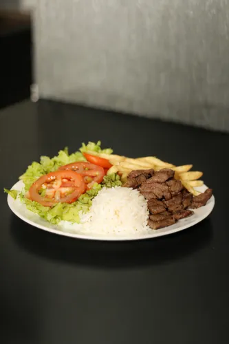 doner kebab,adana kebabı,bulgogi,doner,shawarma,pepper steak,kabab koobideh,churrasco food,ćevapi,beyti kebab,tapa,carne asada,galbi,turkish cuisine,salad plate,fajita,shish taouk,nasi campur,saladito