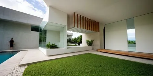 there is a man standing near the swimming pool,artificial grass,modern house,grass roof,landscaped,landscape design sydney,dunes house,Photography,General,Realistic