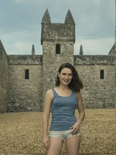 man and woman posing in front of an ancient building,a woman standing next to a castle wall,greenscreen,nuig,girl in a historic way,castles,iulia hasdeu castle,alamo,Photography,Black and white photog