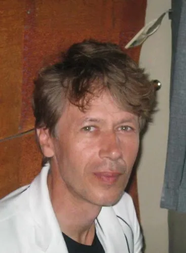 A man in a gray suit in a black shirt ,pushkov,kapranos,klocek,ciolos,morten,sorokin,lauri,shalimov,logvinenko,wroclawski,verbinski,bondarchuk,tolkachev,sarunas,litvinenko,polyansky,tkachev,goncharenk