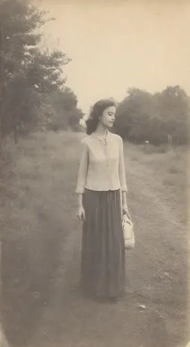 pictorialism,woman walking,tintype,harmlessness,vintage woman,girl walking away,Photography,Polaroid