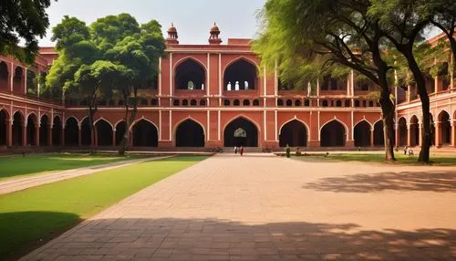 IIT campus, modern architecture, red-brick buildings, sprawling lawns, tall trees, walkways, stairs, lecture halls, libraries, hostels, administrative blocks, faculty buildings, auditoriums, amphithea