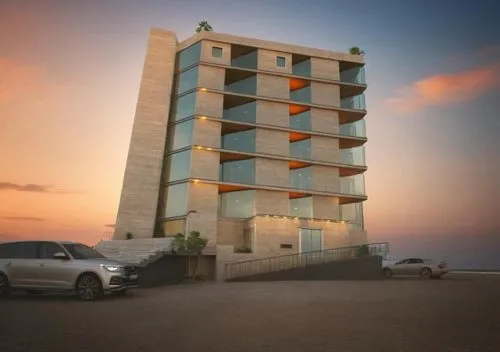 the back of a two story apartment building with parking lot,umhlanga,nouadhibou,baladiyat,nouakchott,herzliya,ashkelon