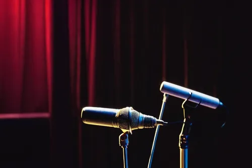 Write a funny conversation about a broken microphone stand in a comedy club.,microphone,microphone stand,mic,stage light,comedy club,stage curtain,stage,the stage,stage equipment,theater curtains,wire