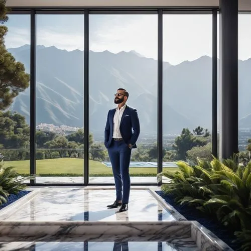 Villa owner, wealthy businessman, 45yo, short black hair, beard, glasses, white shirt, dark blue suit, standing, luxurious villa, modern architecture, large windows, marble floors, high ceilings, beau