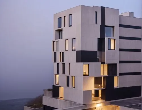 set the cars 
make black walls to concrete 
show street 
,an interesting white building is lit up with some windows,cubic house,habitat 67,modern architecture,escala,cube house,penthouses,residential 