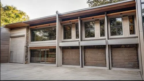 mid century house,garage door,palo alto,timber house,mid century modern,roller shutter,ruhl house,prefabricated buildings,dunes house,garage,frame house,wooden facade,metal cladding,core renovation,ga