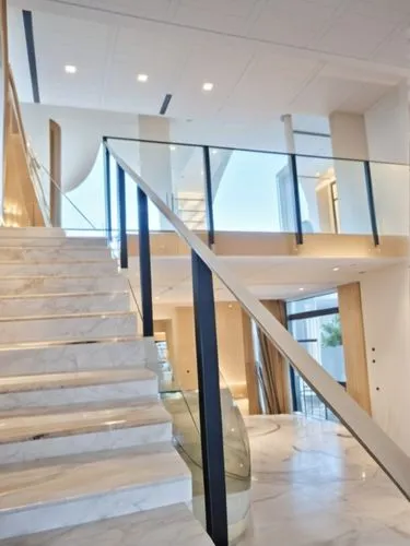 white marmol stais and black smithy and a complete white ceiling,this is a long staircase in a mansion,foyer,outside staircase,balustrades,steel stairs,staircase,winners stairs,Photography,General,Rea