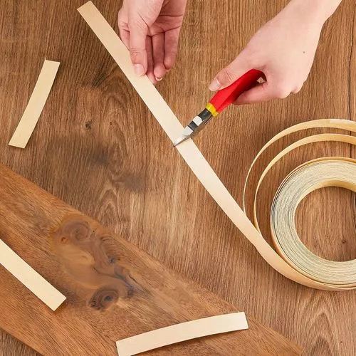 a person making a sculpture out of wood,wooden spinning top,wooden pegs,paper scrapbook clamps,wooden cable reel,wooden rings,wood glue