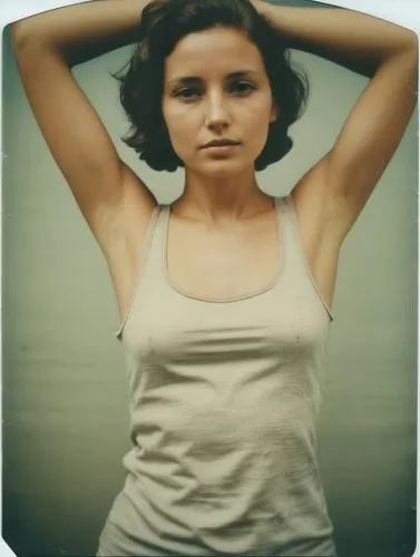 a woman with her hand on her head wearing a tank top,a woman is stretching her arm and hands in the air,vintage female portrait,girl in t-shirt,beren,vintage woman,vintage girl,young woman,Photography