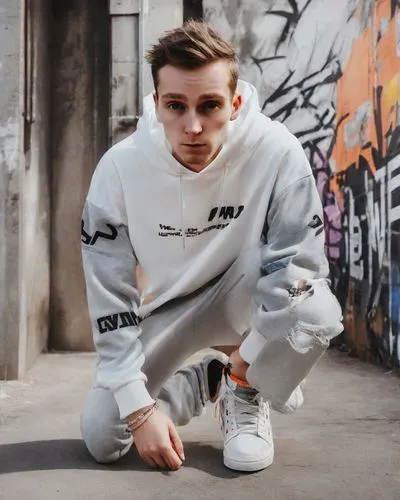 tracksuit,adidas,raf,puma,white clothing,sweatshirt,concrete background,boy,long-sleeve,skater,sweatpant,kaňky,sweatpants,grey background,long-sleeved t-shirt,brhlík,whites,jogger,sportswear,mp4,Photography,Realistic