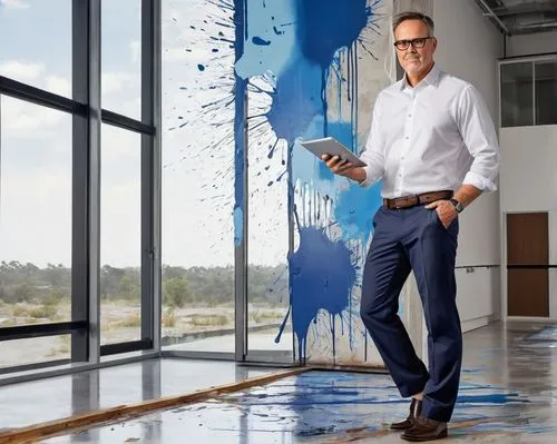 Mid-aged male, Clayton Homes architectural designer, standing confidently, bespectacled, short brown hair, clean-shaven, wearing a white button-down shirt, dark blue trousers, black leather belt, dres