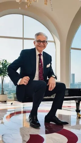 William R Eubanks, mature gentleman, 50s, bespectacled, gray hair, gentle smile, formal wear, black suit, white shirt, burgundy tie, pocket watch, luxurious living room, modern interior design, sleek 