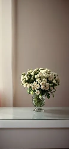 a flower filled vase sitting on top of a counter,flower arrangement lying,ikebana,flower vase,flower arrangement,vase,floral arrangement