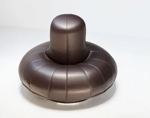 sofa,a white table with a silver object in the middle,bosu,chocolate fountain,shivalingam,singing bowl massage,game joystick,bowl of chocolate,3D,Modern Sculpture