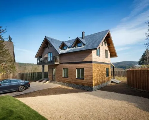 an image of a home in the daytime,passivhaus,timber house,inverted cottage,cohousing,weatherboarded,wooden house