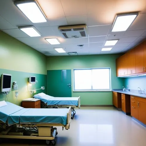 a room with two beds and many cabinets,operating room,hospital ward,children's operation theatre,hospitalizations,ambulatory,healthcare medicine,doctor's room,emergency room,hospital,treatment room,sp