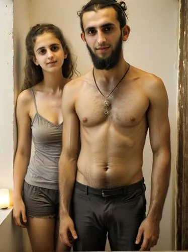 The picture shows a young orthodox Jew and his young wife in a modern, well-lit interior. ,man with short underwear standing next to woman with ,makdessi,jordanians,jihadjane,israeli,jordanian,belkace