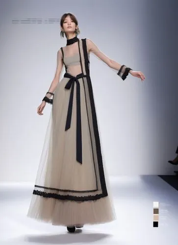 a woman walking down a runway wearing a long dress,a floor-length dress,vionnet,tahiliani,dress walk black,dior,siriano,Photography,Fashion Photography,Fashion Photography 10