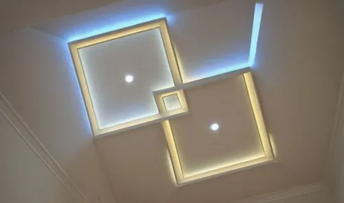 Gypsum decoration in the ceiling of a room with hidden LED lighting,a lit ceiling with different lighting inside of it,ceiling light,ceiling lighting,velux,wall light,ceiling lamp,skylights,wall lamp,