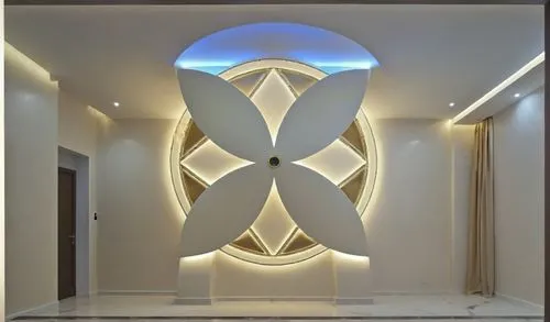 
Gypsum decoration in the ceiling of a room with hidden LED lighting,a decorative wall in an artful room, lighted by a circular chandelier,wall lamp,wall light,led lamp,interior decoration,wall plaste