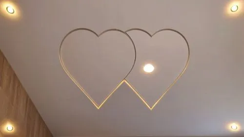 Convert this layout into a real gypsum decor for a room with hidden lighting.,three heart - shaped lights strung from the ceiling in the shape of mountains,wall lamp,wall light,heart shape frame,valen