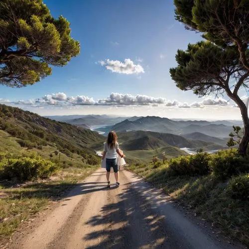 a person standing on top of a dirt road in the mountains,serra de tramuntana,buencamino,provencal life,tuscany,toscana,aspromonte