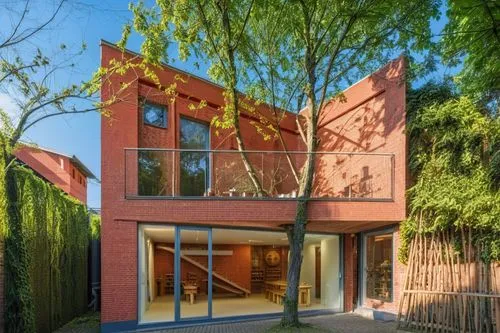 souvenir market in berlin built around existing trees. red bricks is the building material. the market is built on the musuem island beside many musuems.,exzenterhaus,modern house,mid century house,lu