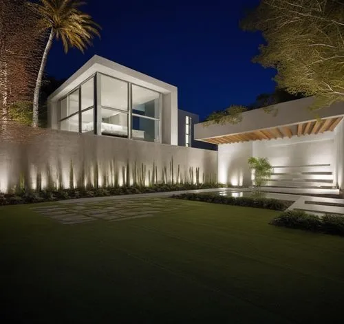 Diseño exterior de una casa moderna estilo minimalista combinando muros de color blanco con muros de tabique aparente, herrería de aluminio con cristal, fotografía hiperrealista, fotografía arquitectó