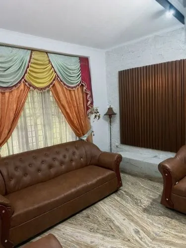 Brown ribbed accent wall,interior decoration,interior decor,home interior,sofa set,furnishings,contemporary decor,parlor,family room,sitting room,search interior solutions,brown fabric,decor,living ro