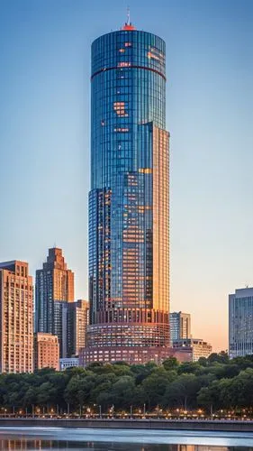 The skyscraper stands majestically against the skyline, its sleek and innovative design a testament to modern architectural excellence. The facade is a seamless blend of glass and steel, reflecting th