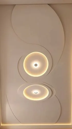 Gypsum decoration in the ceiling of a room with hidden LED lighting,a very white room with a bunch of lights,ceiling light,ceiling lamp,wall lamp,ceiling lighting,wall light,ceiling construction,Photo