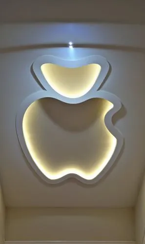 Gypsum decoration in the ceiling of a room with hidden LED lighting,the inside of an apple themed ceiling with illuminated light,wall lamp,ceiling light,wall light,ceiling lamp,apple logo,foscarini,Ph