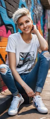 Customizable avatar, young adult, slender build, short spiky hair, bright blue eyes, subtle smile, casual wear, ripped jeans, black graphic t-shirt, white sneakers, relaxed pose, leaning against a gra