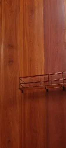 estanteria color rojisa,this metal shelf is attached to a wall,laminated wood,sapele,wood casework,padauk,wooden shelf,wooden wall,paneling,embossed rosewood,wood grain,credenza,highboard,woodgrain,ha