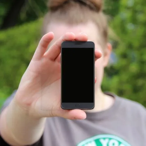 woman holding a smartphone,background bokeh,viewphone,wet smartphone,phone clip art,mobile camera,phone icon,iphone 6s plus,iphone 6 plus,video phone,phone,handheld device accessory,the app on phone,mobile phone case,iphone 7,music on your smartphone,iphone 6s,using phone,ifa g5,iphone