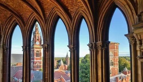 Historic Ipswich town hall, grandiose Victorian-era architecture, ornate stone carvings, stained glass windows, Gothic Revival style, intricate brick patterns, pointed arches, ribbed vaults, flying bu