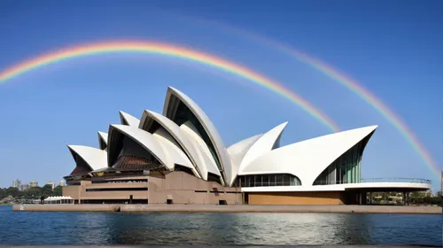 a modern architecture, fish shape,  white exterior, curved lines, consistent style, rainbow,opera house sydney,sydney opera house,sydney opera,opera house,rainbow bridge,australia aud,sydney australia