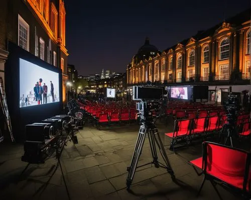 Modern architecture, design film festival, London cityscape, evening atmosphere, cinematic composition, wide-angle shot, iconic buildings, glass and steel structure, sleek lines, geometric shapes, vib