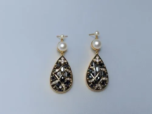 the gold earrings with pearls and stones is displayed on a white surface,marcasite,earrings,teardrop beads,anting,earring,mouawad,Photography,General,Realistic