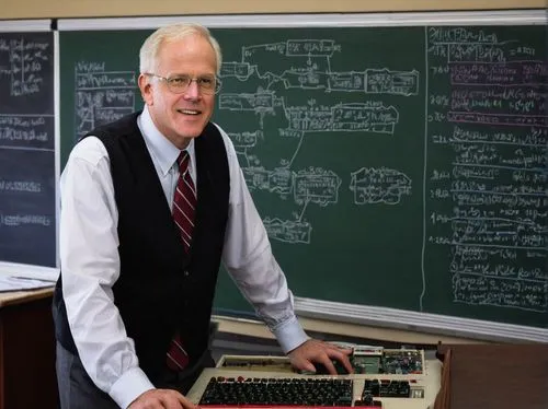 John L Hennessy, Stanford professor, 60s, grey hair, glasses, suit, white shirt, tie, lecturing, standing, university classroom, wooden desk, blackboard, computer hardware diagrams, circuit boards, wi