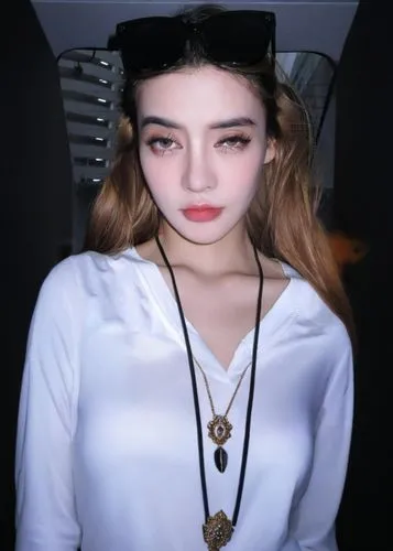 a young woman wearing shades and a black necklace,natashquan,lilyana,fumie,gabsi,phuquy,poki,kazzia,snapstream,zhaowen,janet,yejju,haosu,zhaosu,padhye,dajie,kaewkamnerd,sephie,white shirt,twitch icon,