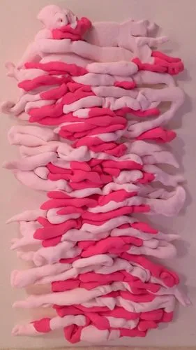 a white wall with pink colored arms and legs,candy cane bunting,paper chain,crepe paper,candy sticks,candy canes,cardstock tree,Unique,3D,Clay