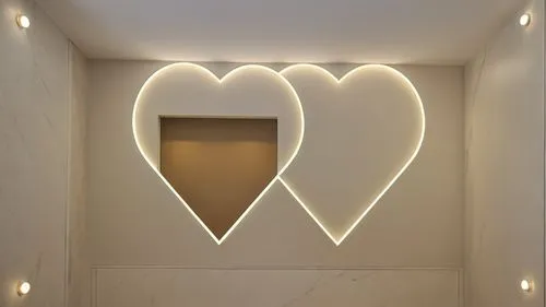 Gypsum decor in the ceiling of a room with hidden lighting, real decor,two large hearts decorate the walls above a bathroom sink,wall light,wall lamp,heart shape frame,foscarini,lovemark,neon valentin