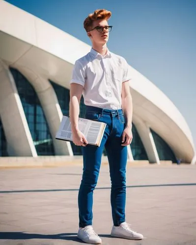 Modern university student, male, 20yo, casual wear, jeans, white shirt, sneakers, holding large architecture portfolio, standing in front of a sleek, contemporary building, glass and steel structure, 