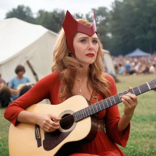 Make her with a late 1960s hippie red dress. She is playing an acoustic guitar. The background is the Woodstock festival.,scarlet witch,devil,folk festival,folk music,balalaika,costume festival,fantas