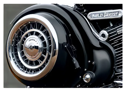 Harley Davidson motorcycle, shiny black body, chrome exhaust pipes, leather saddle, silver handlebars, detailed engine, spinning wheels, low-angle shot, dramatic lighting, cinematic composition, warm 