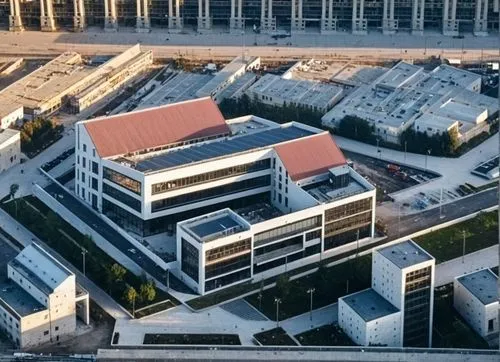 un edificio ubicado en una ciudad, su arquitectura esta basada en el constructivismo ruso.,an aerial view of the outside and inside of a building,aerial view,aerial image,new building,aerial photograp