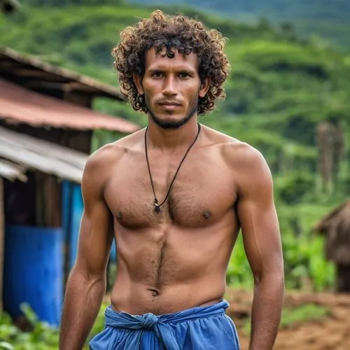 Joven de 30 años de cabello rizado 30 años de edad, hombre humilde, sin barba ni bigote, delgado, vive en una finca en Guacamayal, un pueblo en la zona bananera del departamento del Magdalena, Colombi