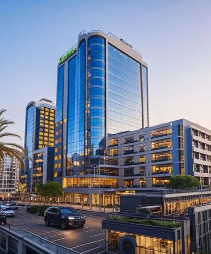 a very modern building with many windows, next to a parking lot,sandton,umhlanga,cape town cbd,herzliya,gaborone,rotana,coastlands,port elizabeth,investec,durban,ethekwini,rivonia,ashdod,ghurair,large